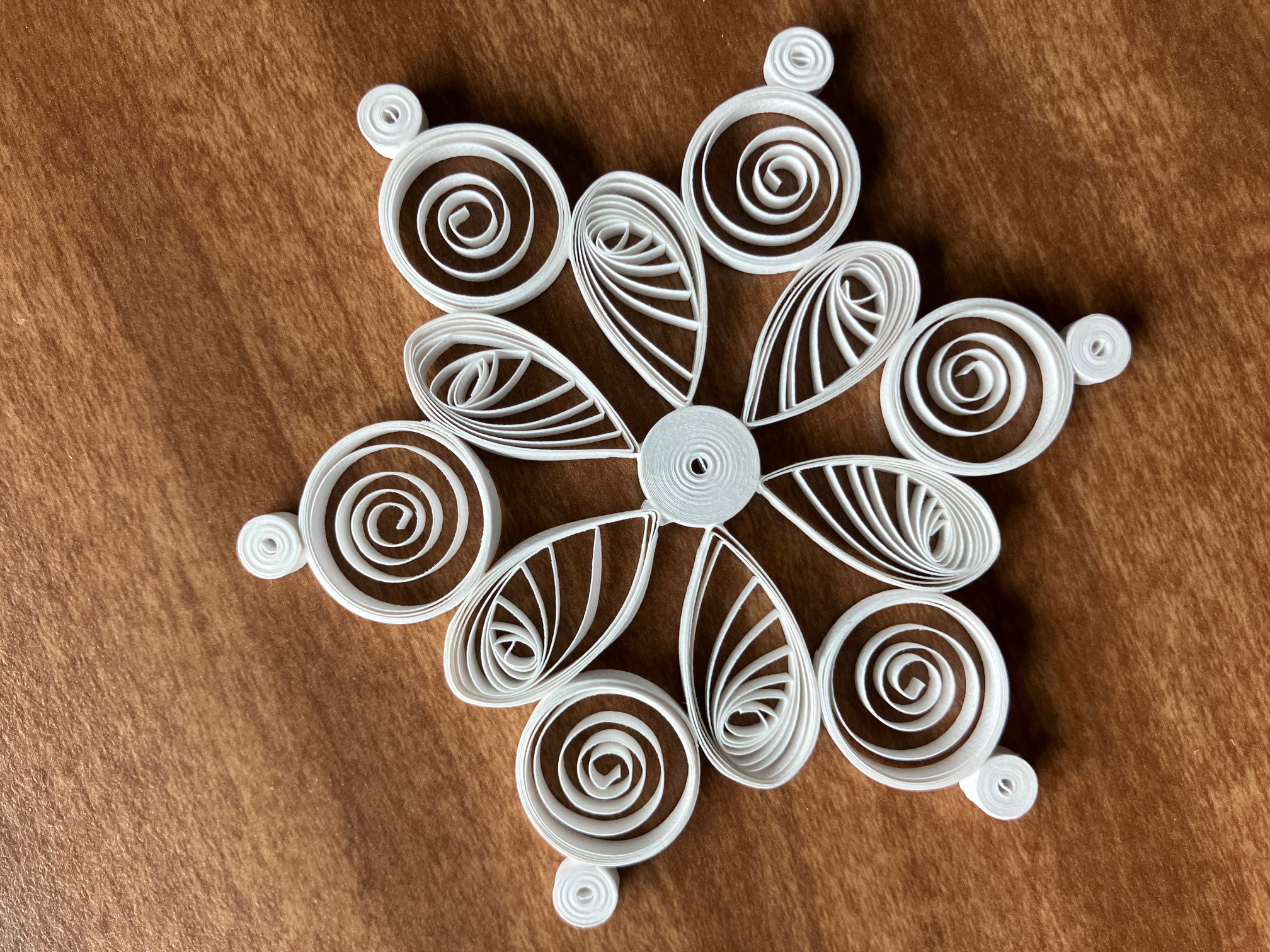 White paper snowflake made from curled paper