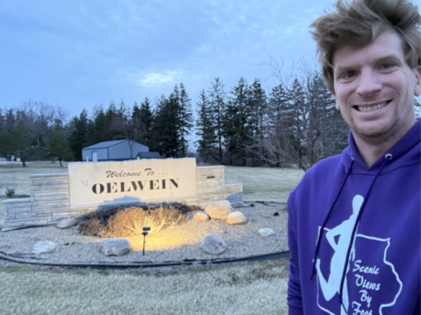 Picture of Tyler Sullivan in font of the stone Oelwein sign.png
