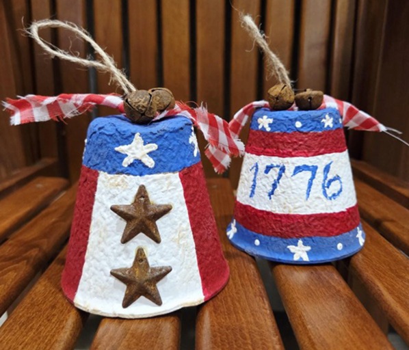 picture of cardboard bell shapes painted red, whit and blue